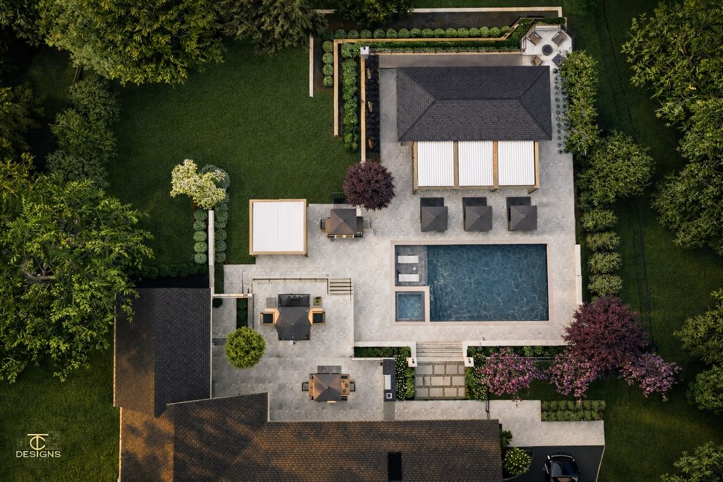 Luxury pool with illuminated fire features at night